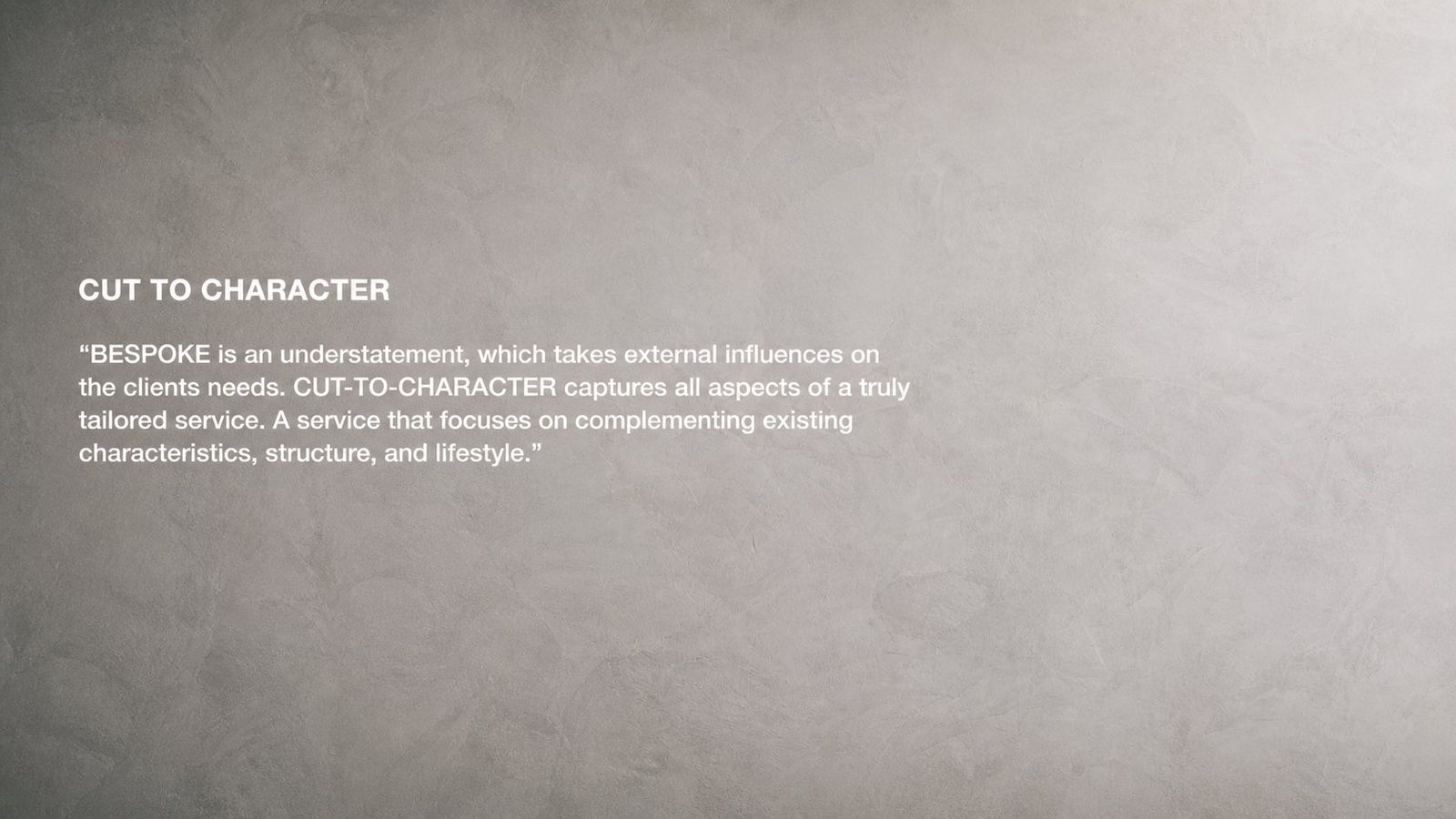 CUT TO CHARACTER brand philosophy text on concrete wall